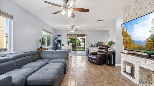 living room with light hardwood / wood-style flooring