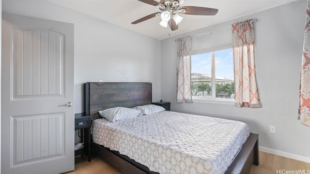 bedroom featuring ceiling fan and light hardwood / wood-style floors