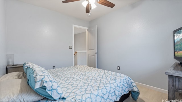 bedroom with light wood-type flooring and ceiling fan