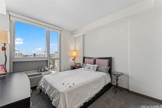 bedroom with dark colored carpet