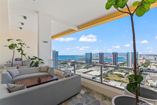 balcony featuring an outdoor hangout area and a water view