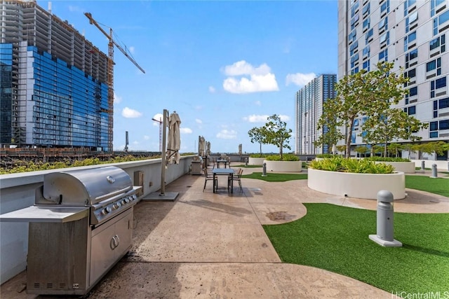 view of patio with a grill