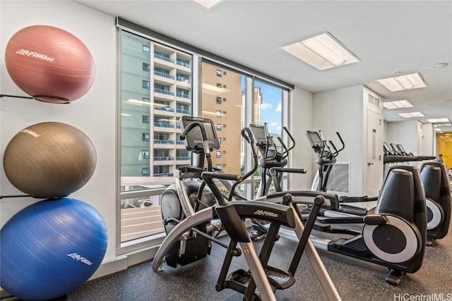 workout area featuring a wall of windows