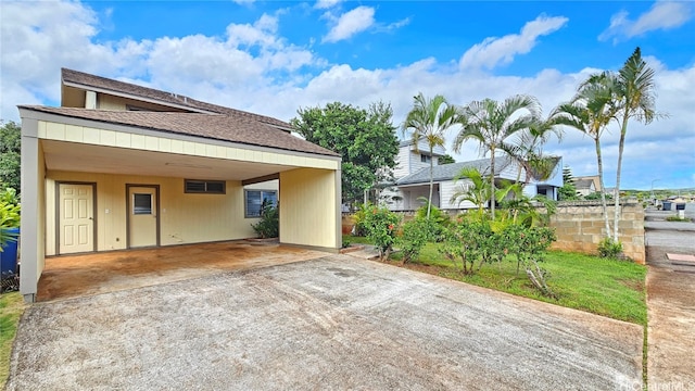 exterior space with a carport