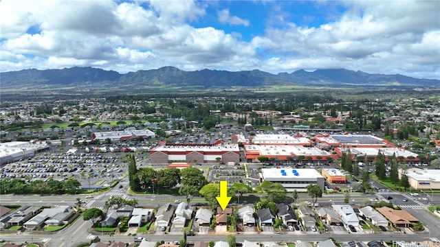 birds eye view of property with a mountain view