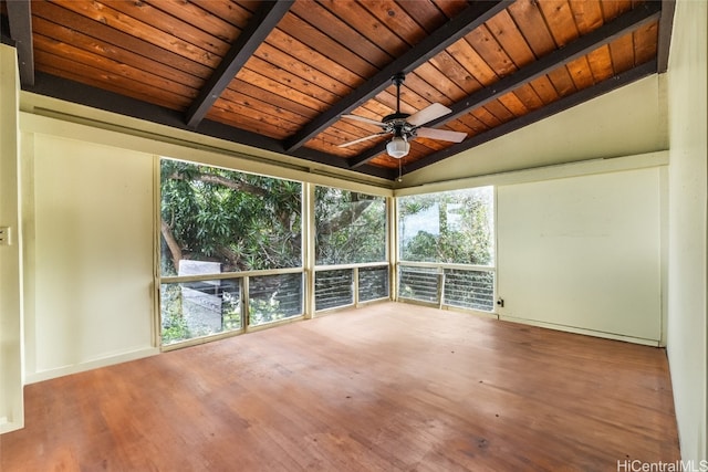 unfurnished sunroom featuring vaulted ceiling with beams, wood ceiling, and ceiling fan