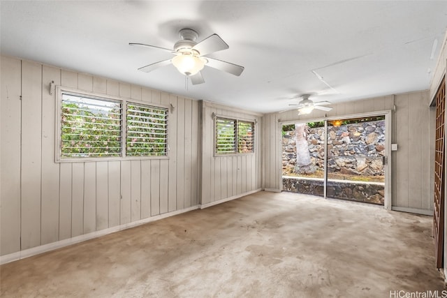 spare room featuring wooden walls