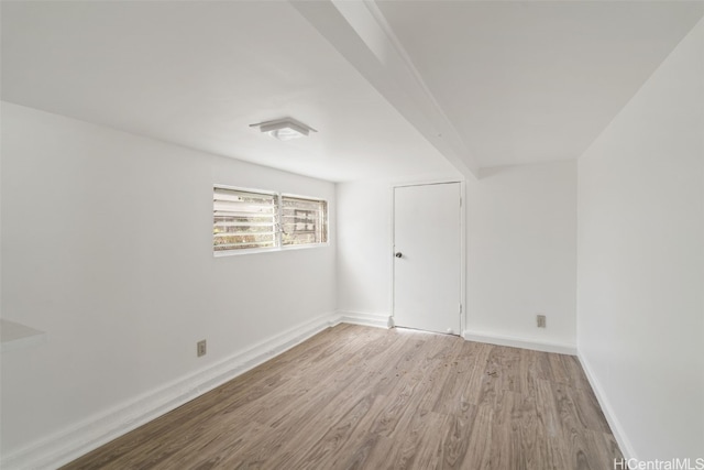 spare room featuring light hardwood / wood-style floors