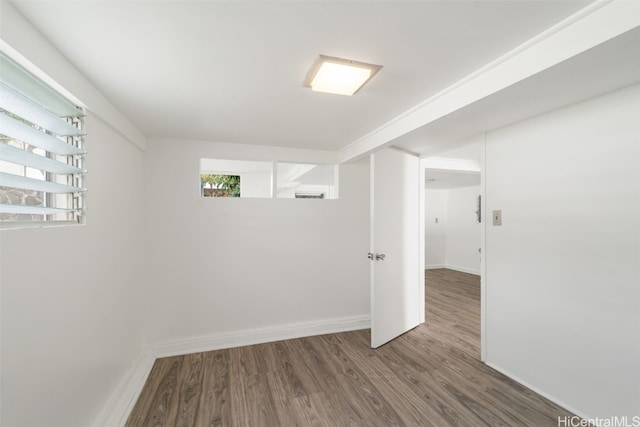 empty room featuring dark wood-type flooring