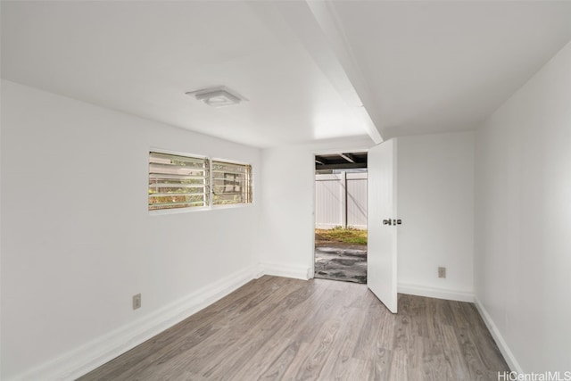 spare room with light hardwood / wood-style flooring