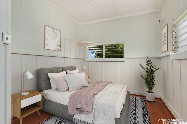 bedroom featuring dark hardwood / wood-style flooring