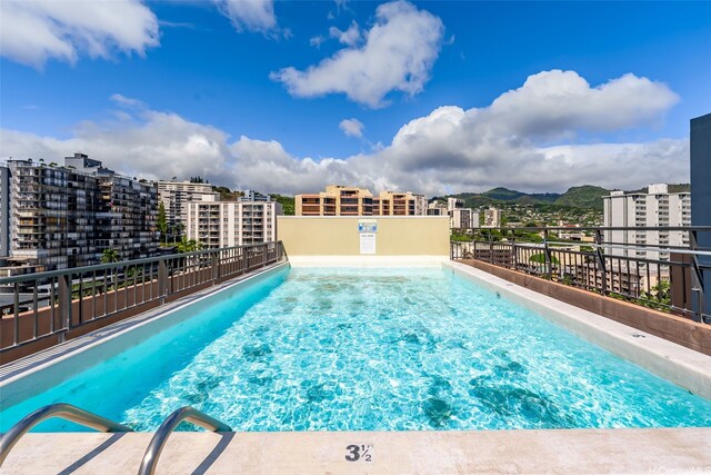 1040 Kinau St Unit 704, Honolulu, HI 96814 - community pool featuring a mountain view