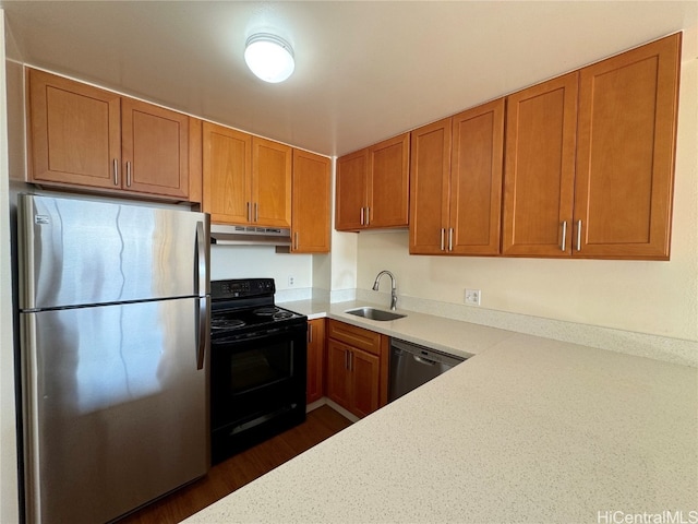 kitchen featuring dark wood-type flooring, appliances with stainless steel finishes, and sink