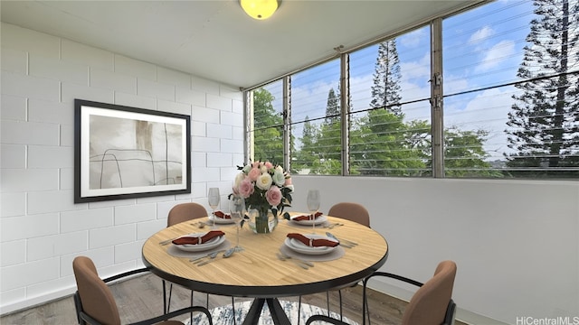 dining space featuring wood-type flooring