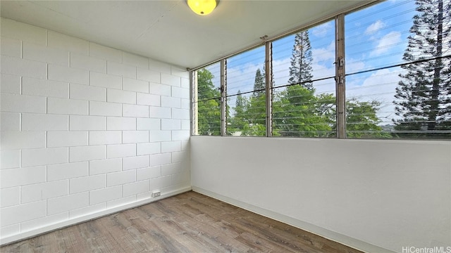 unfurnished room featuring hardwood / wood-style floors