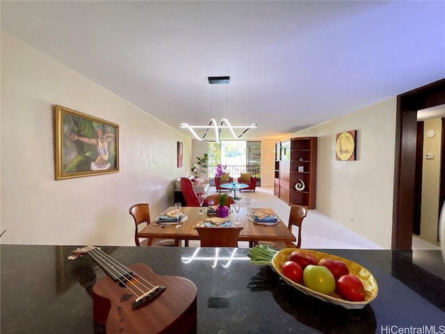 dining area with an inviting chandelier