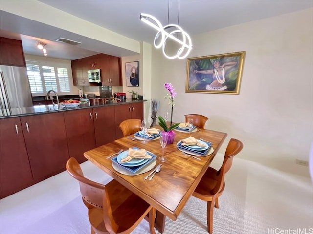 view of carpeted dining space