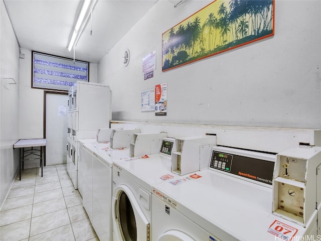 laundry area featuring washer and clothes dryer, stacked washer and clothes dryer, and light tile patterned floors