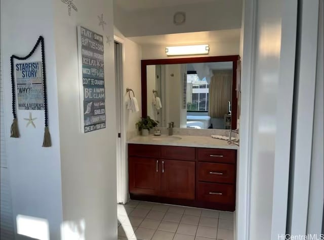 bathroom with tile patterned flooring and vanity