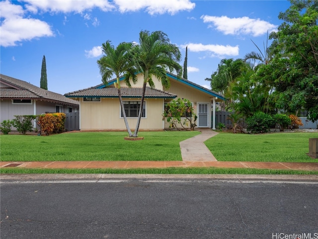 ranch-style house with a front yard