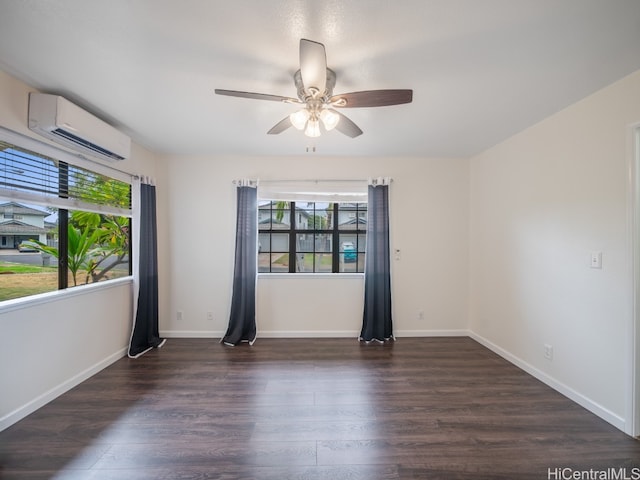 unfurnished room featuring dark wood-type flooring, a wall mounted air conditioner, and ceiling fan