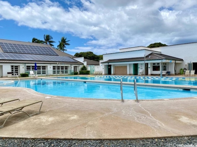 view of swimming pool featuring a patio area