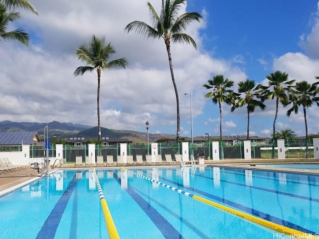 view of swimming pool featuring a mountain view