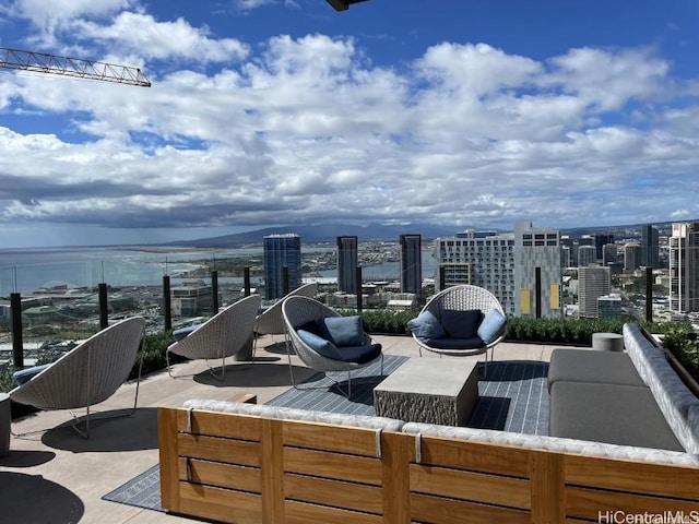 view of patio / terrace with a view of city and an outdoor hangout area