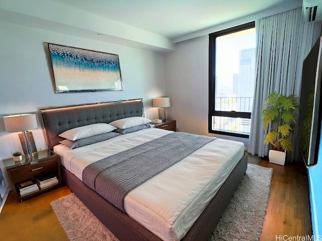 bedroom featuring wood finished floors