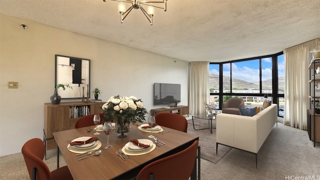 dining area with a chandelier, light colored carpet, floor to ceiling windows, and a textured ceiling