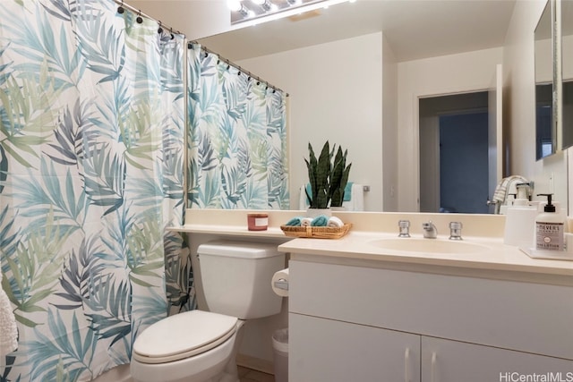 bathroom featuring vanity and toilet