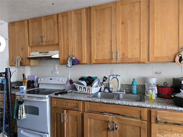 kitchen featuring sink and white range with electric stovetop