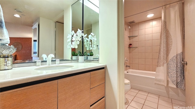 full bathroom with tile patterned flooring, vanity, toilet, and shower / tub combo