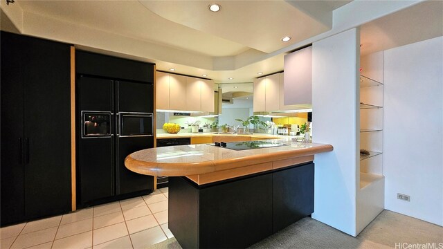 kitchen featuring black appliances, sink, kitchen peninsula, light tile patterned floors, and white cabinetry