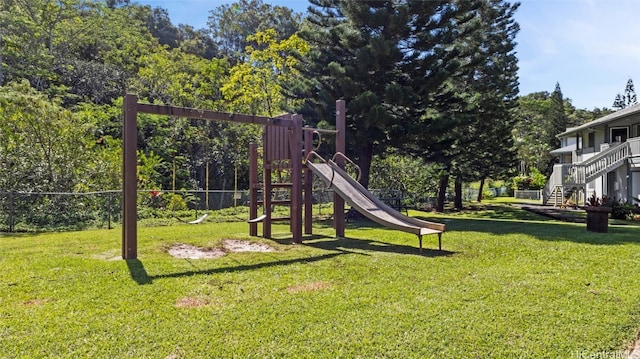 view of jungle gym featuring a lawn