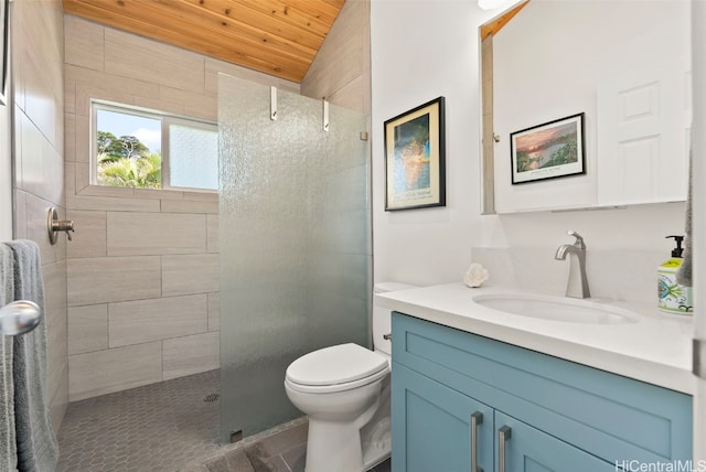 bathroom with tiled shower, vanity, wood ceiling, and toilet