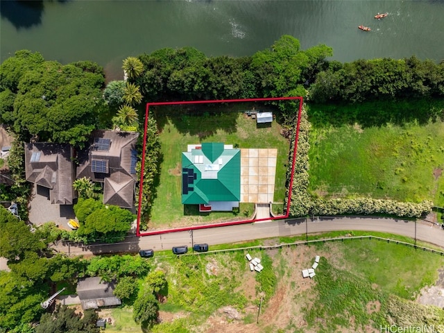 birds eye view of property with a water view