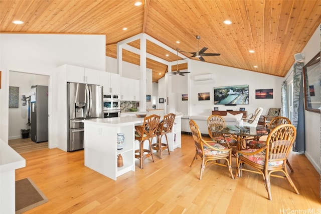 kitchen with white cabinetry, wooden ceiling, and stainless steel appliances