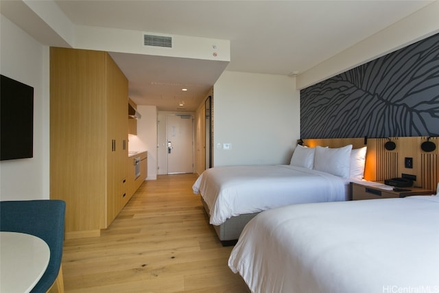 bedroom with light hardwood / wood-style floors