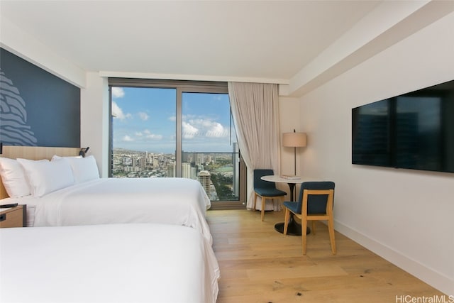 bedroom with light hardwood / wood-style floors