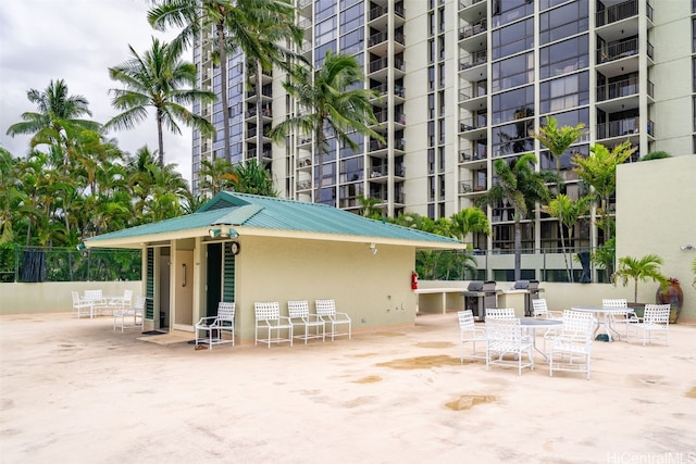 view of home's community with a patio area