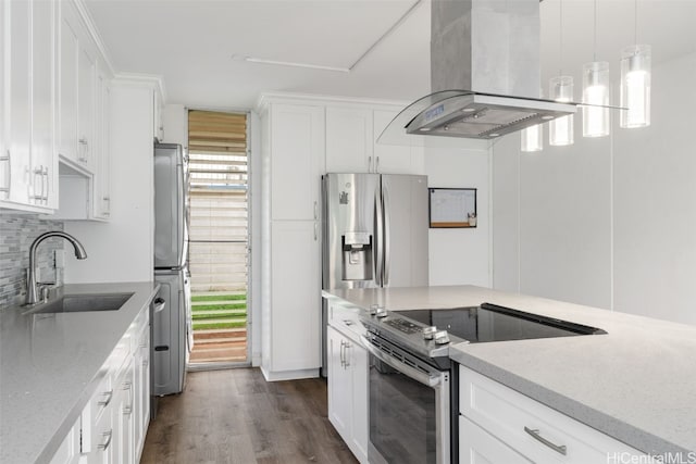 kitchen featuring island range hood, white cabinetry, appliances with stainless steel finishes, dark hardwood / wood-style flooring, and sink