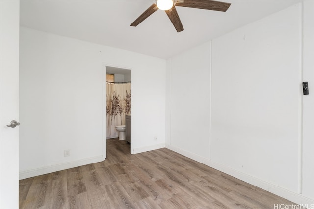 empty room with light wood-type flooring and ceiling fan