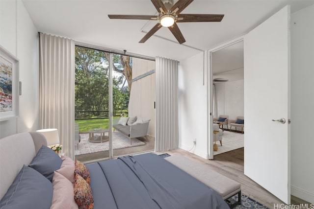 bedroom with ceiling fan, access to exterior, and wood-type flooring