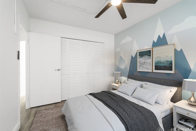 bedroom featuring a closet, hardwood / wood-style floors, and ceiling fan