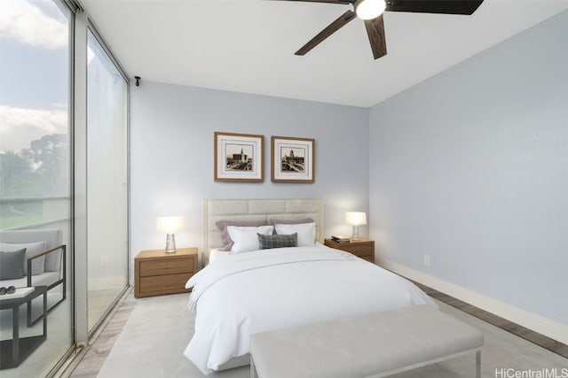 bedroom with ceiling fan and light hardwood / wood-style flooring