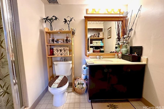 bathroom with toilet and vanity