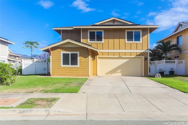 front of property with a front lawn and a garage