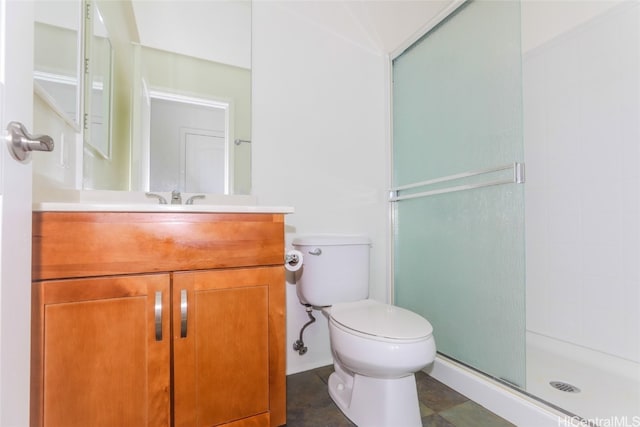 bathroom with vanity, toilet, and a shower with shower door