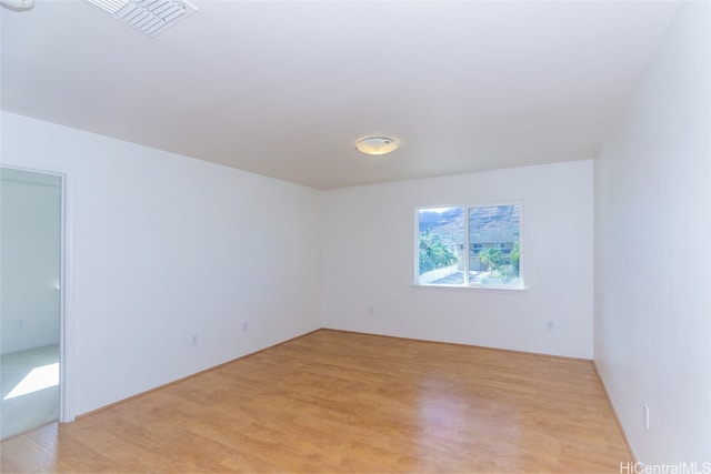 unfurnished room featuring light hardwood / wood-style floors